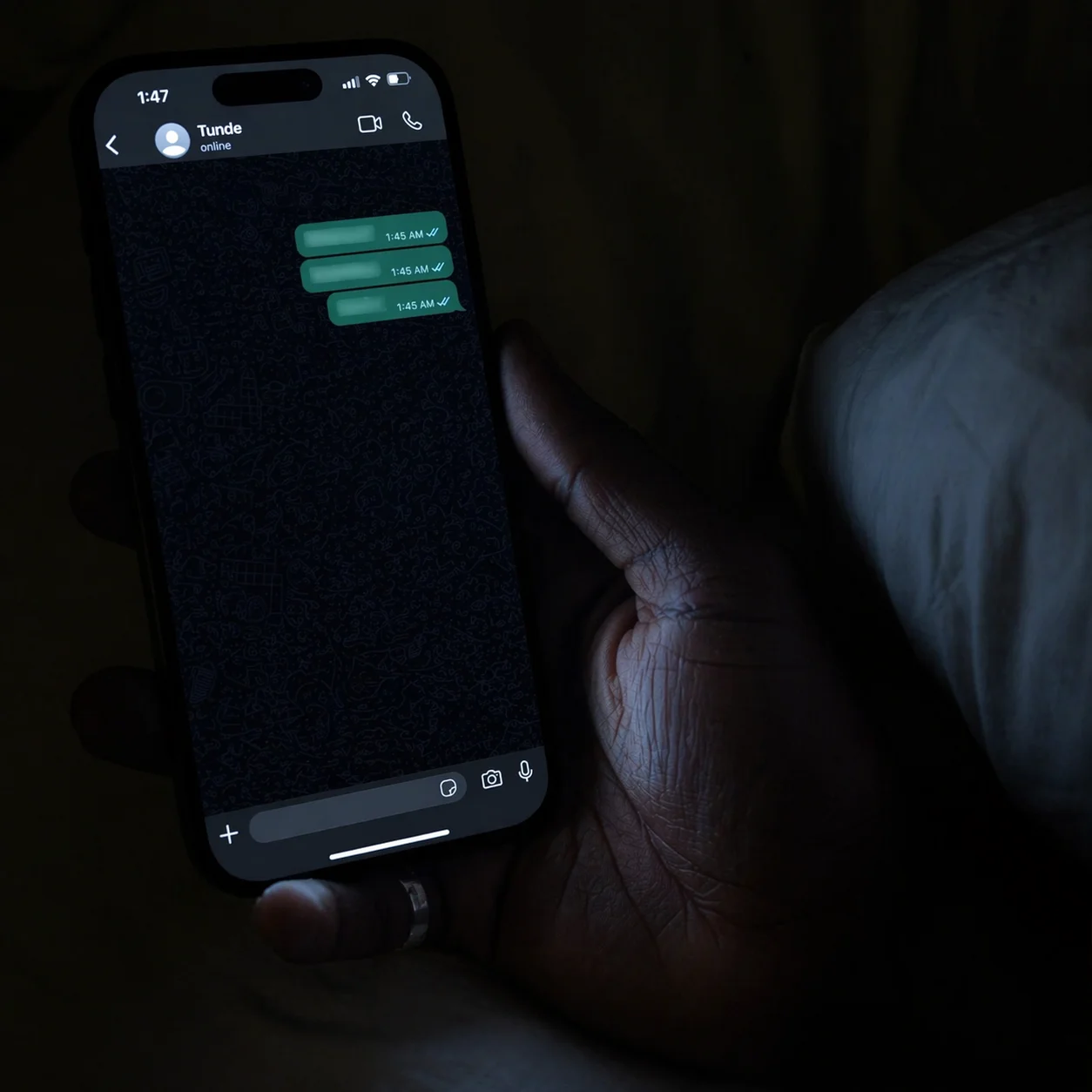 Phone screen at 1:47 AM, WhatsApp message from Tunde