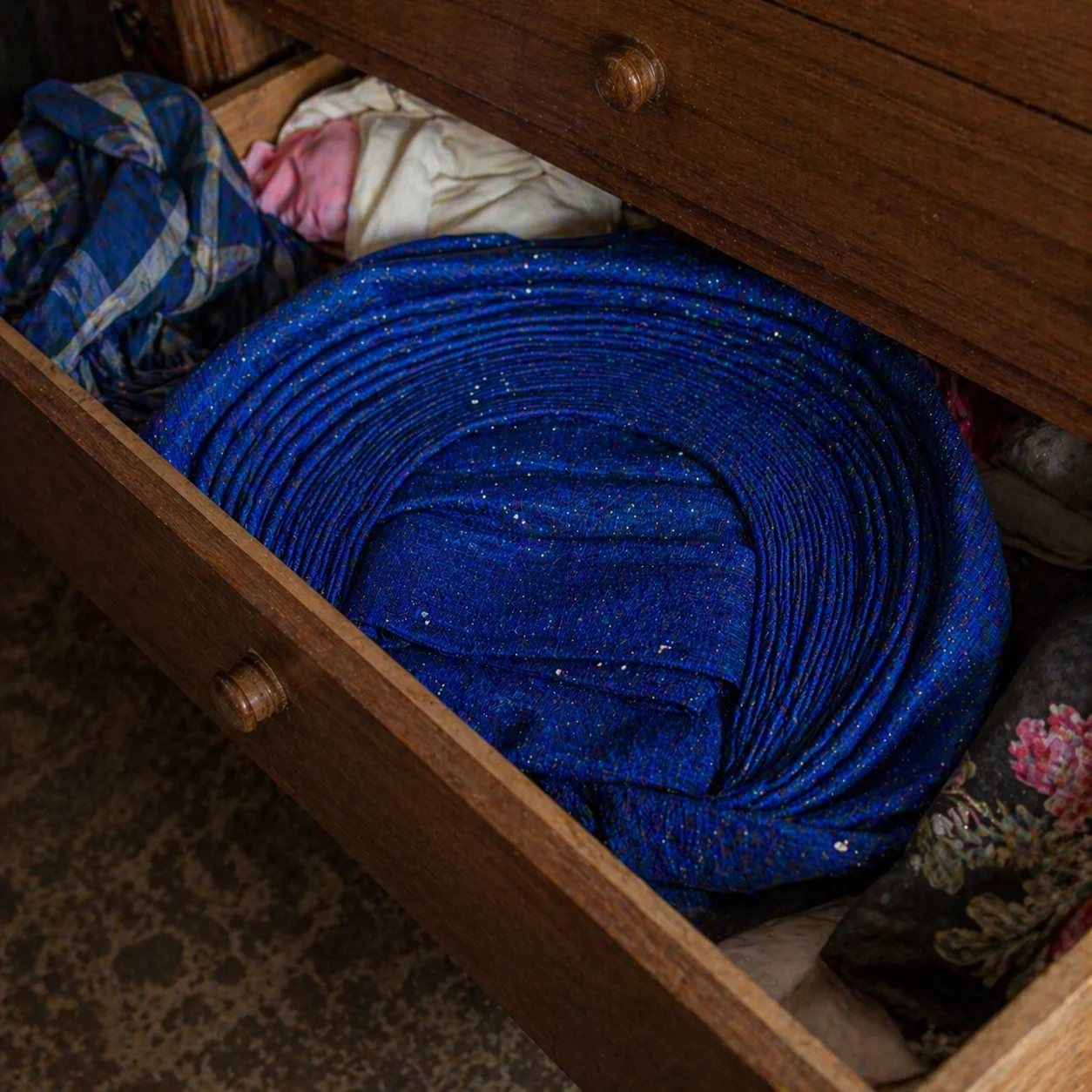 Blue gele folded in a wardrobe drawer, untouched